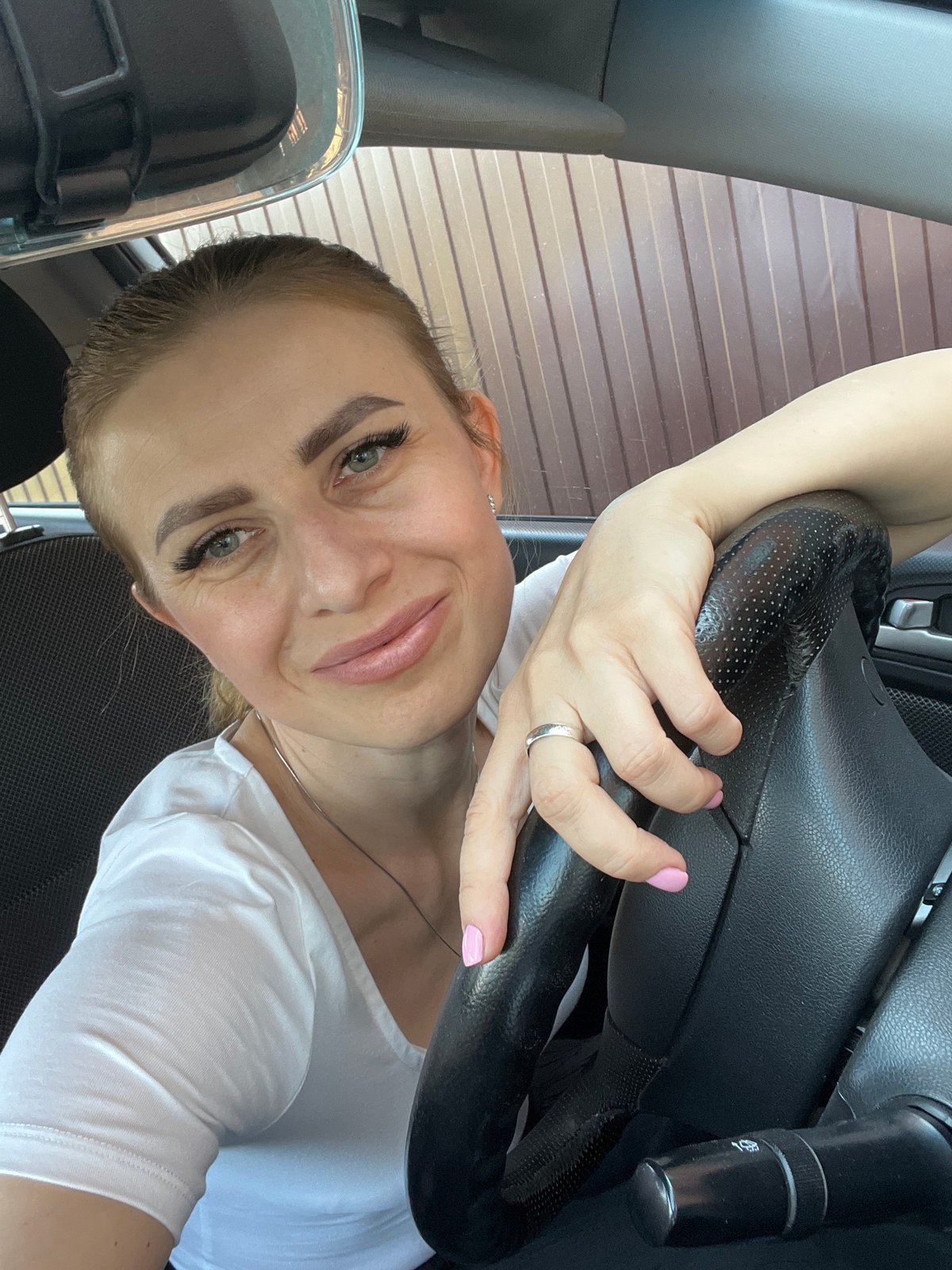Selfie from a parked car near a residential fence in Bataysk