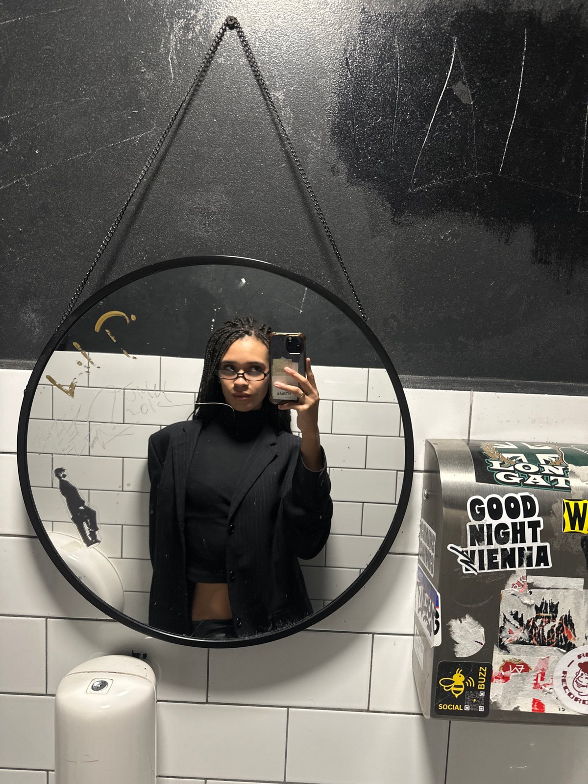 Mirror selfie taken in London public restroom facility