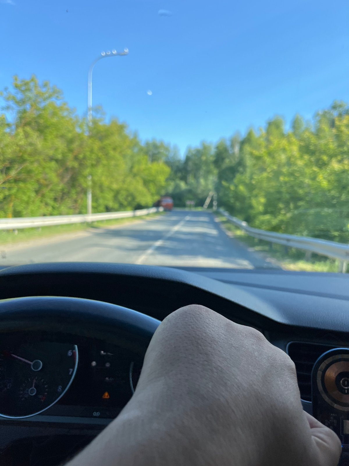Car journey documented through Vasilyevo, Russia on wet roads