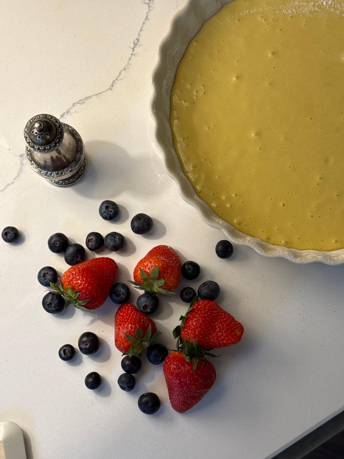 Home baker prepares berry pie with child helper in Moscow