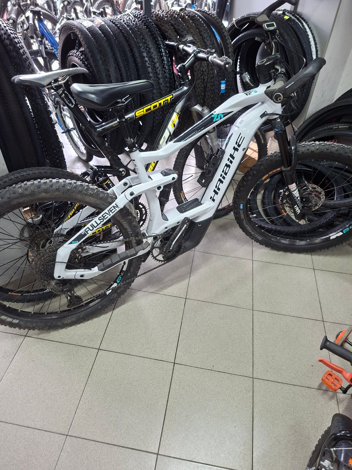 White electric bicycle spotted parked indoors in Gabrovo, Bulgaria