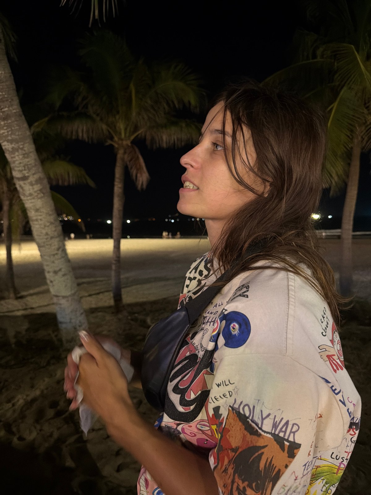 Nighttime beach scene in Da Nang with hoop acts and beachfront bars