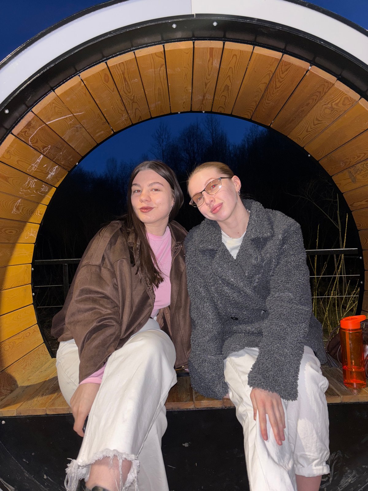 Young women photographed at outdoor structures in Perm