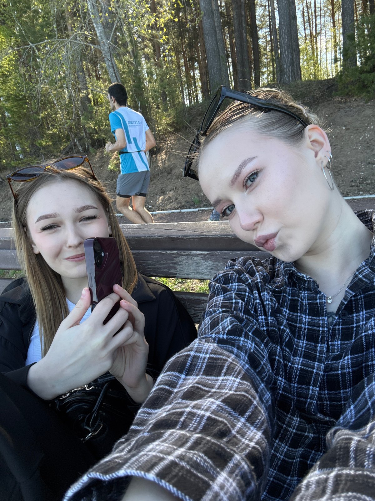 Two women enjoy leisure time at Chaikovsky waterfront