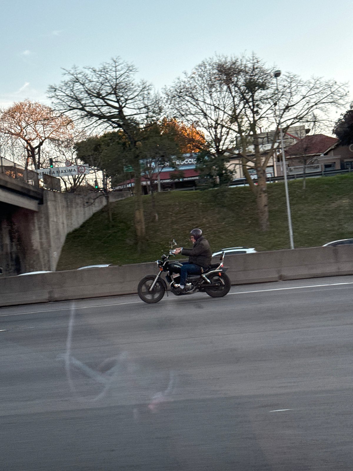 Motorcyclist travels highway in Vicente López, Argentina