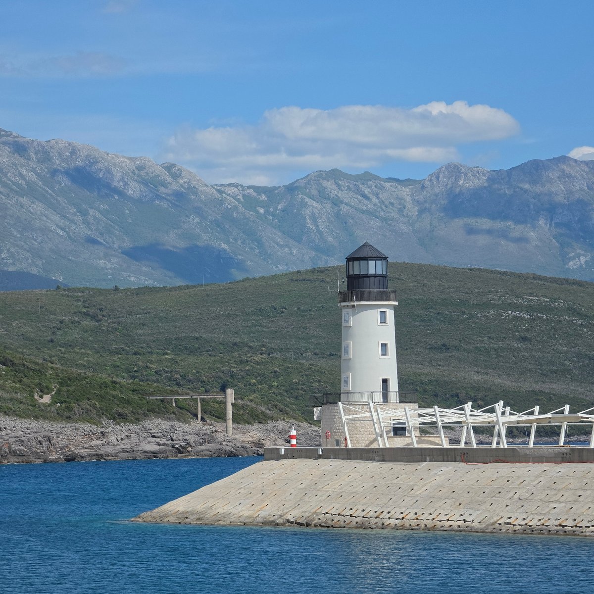 Coastal scenes captured in Radovići, Montenegro on sunny afternoon