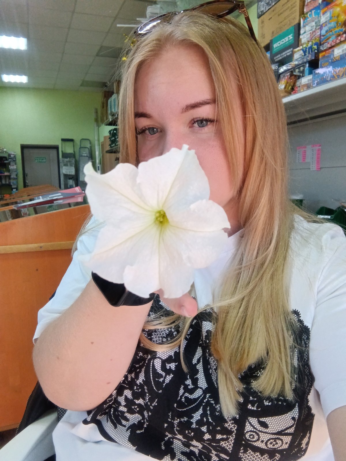Woman poses for photos in Russian village store