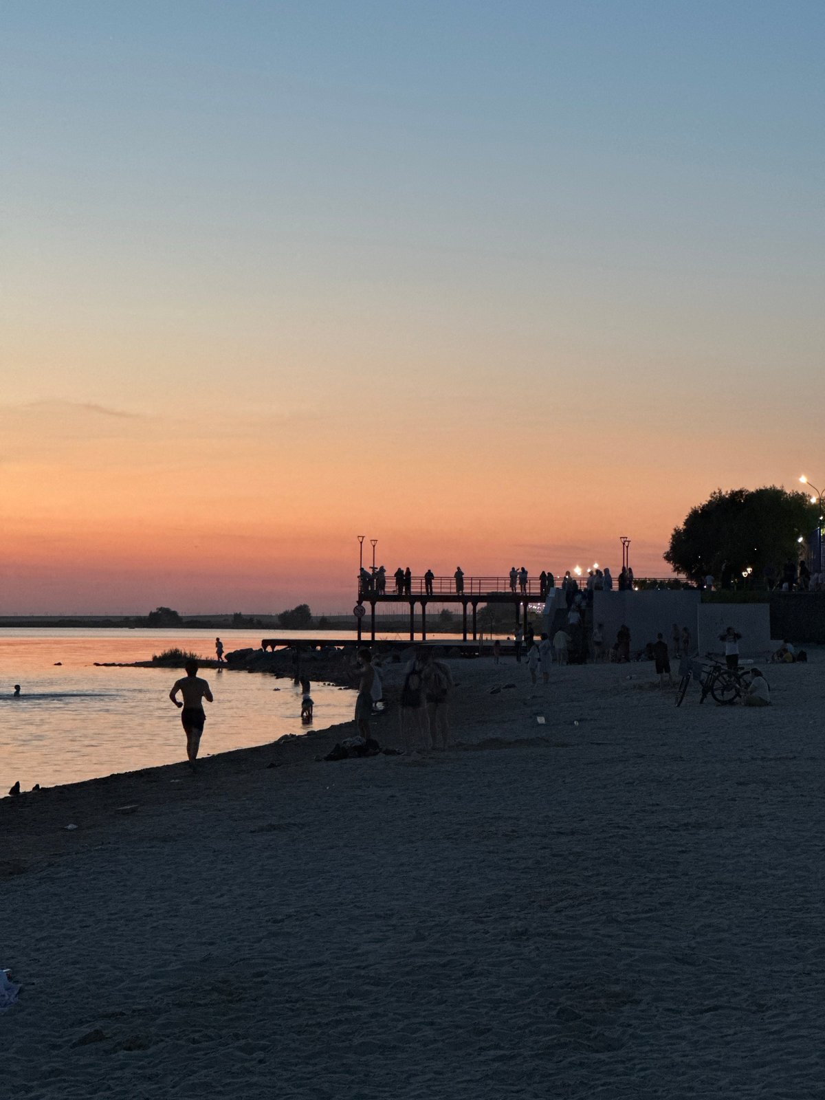 Kokshetau's Lake Borovoe beach at golden hour