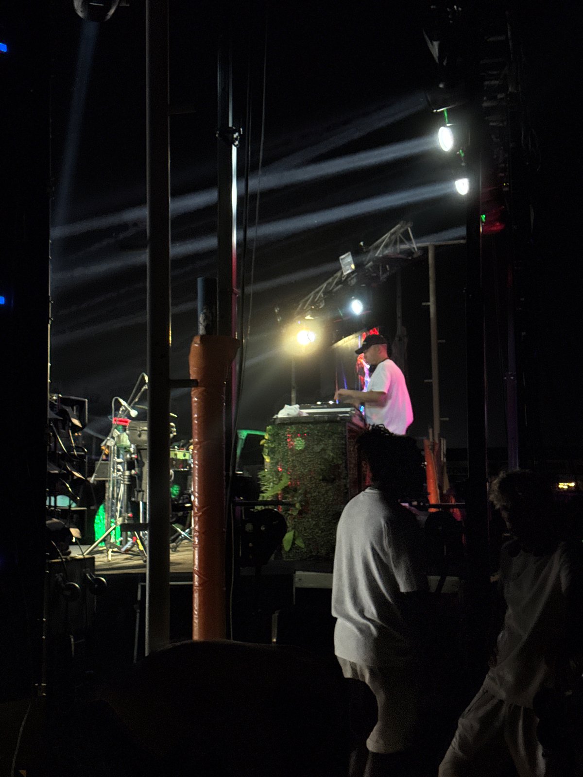 Outdoor DJ set at a beachside venue in Aksu at night