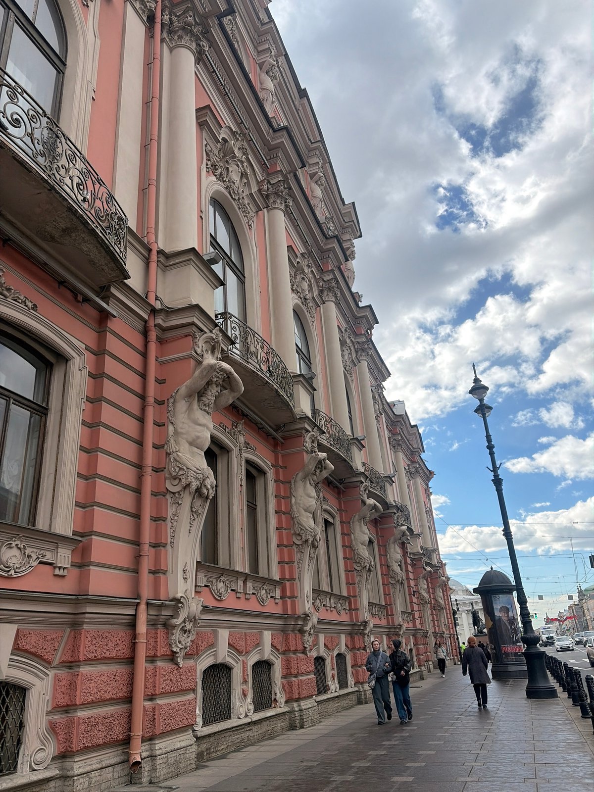 Tourist documents Saint Petersburg's historic architecture during midday stroll