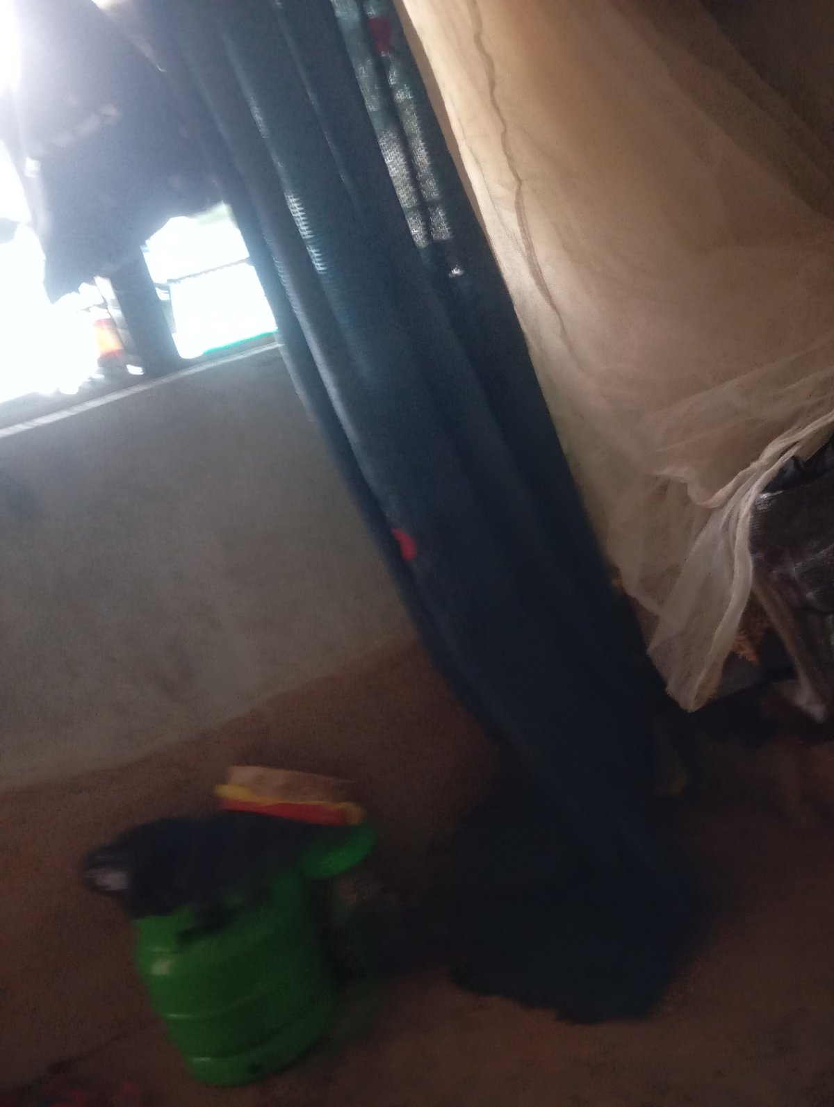 Indoor room with artificial grass flooring and sewing setup