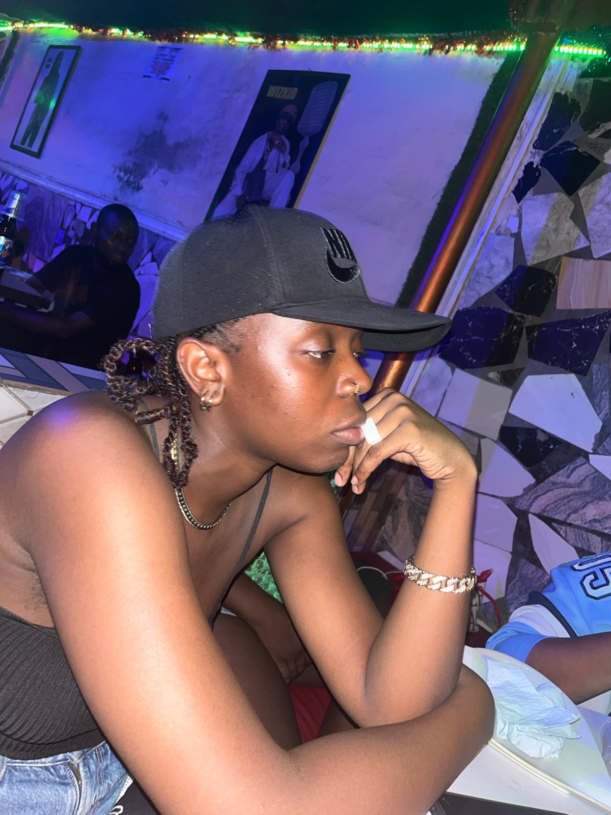 Social gathering documented at Jalingo nightclub with colorful lighting