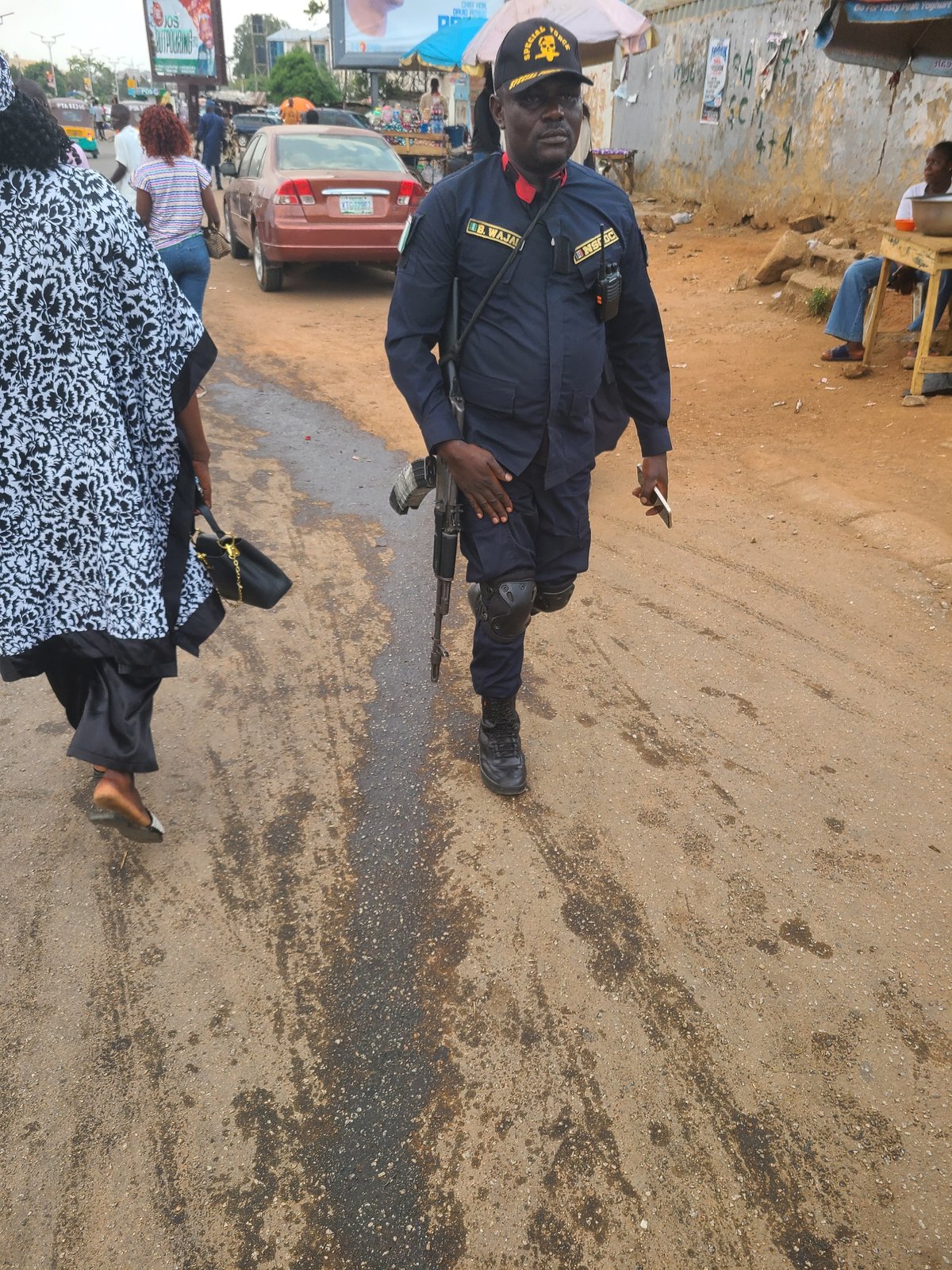 Street activity including armed police presence observed in Jos