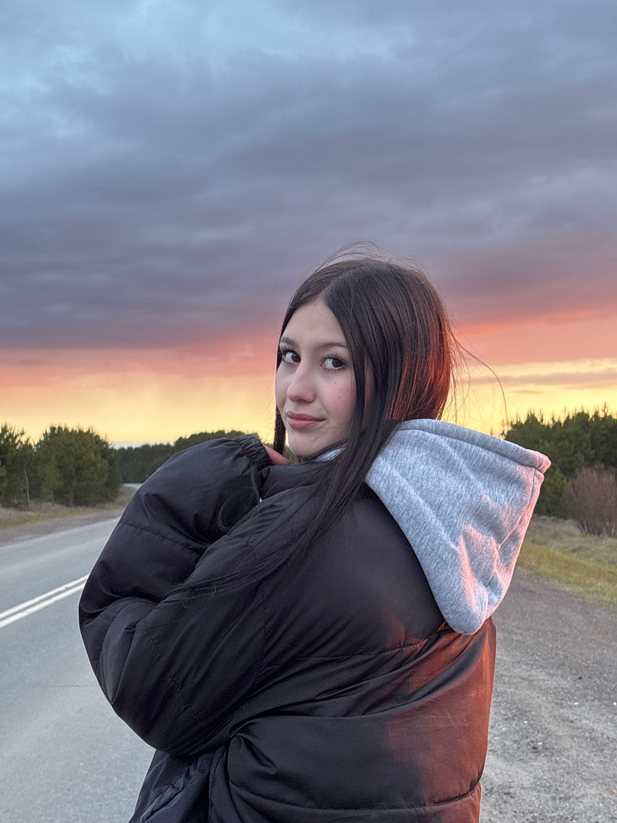 Woman photographed outdoors during twilight in Фоки, Russia