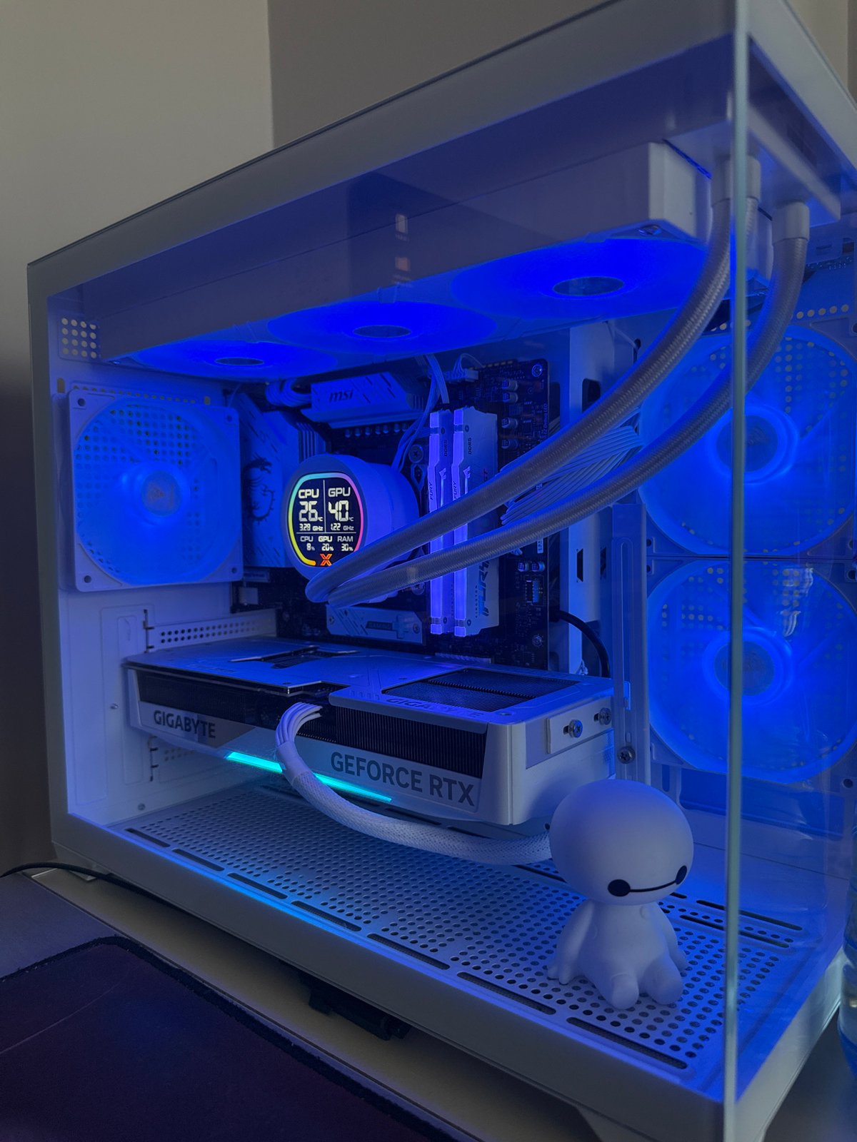 Computer case interior with blue LED fans documented in Bulgaria