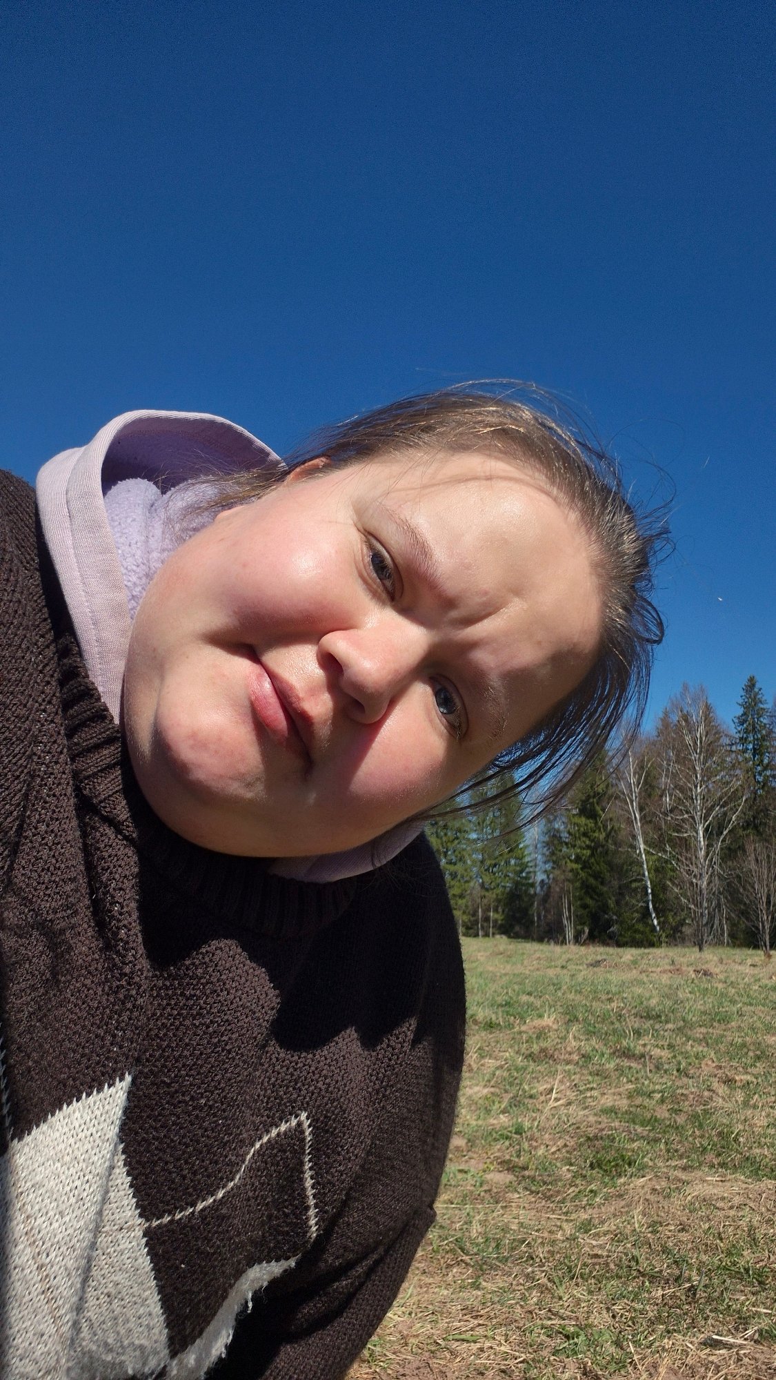Woman takes outdoor selfies in Russian countryside with local farm life