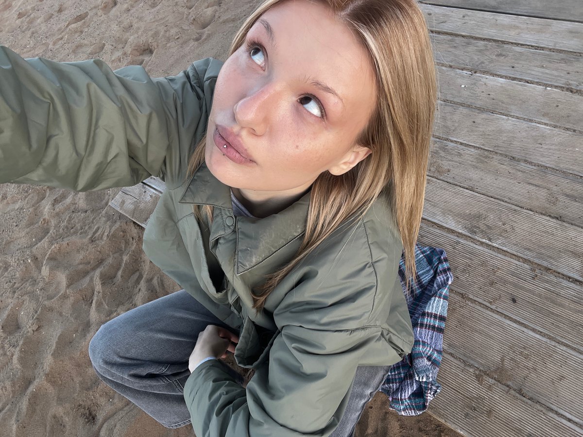 Woman spends spring afternoon at Chaikovsky beach taking photos