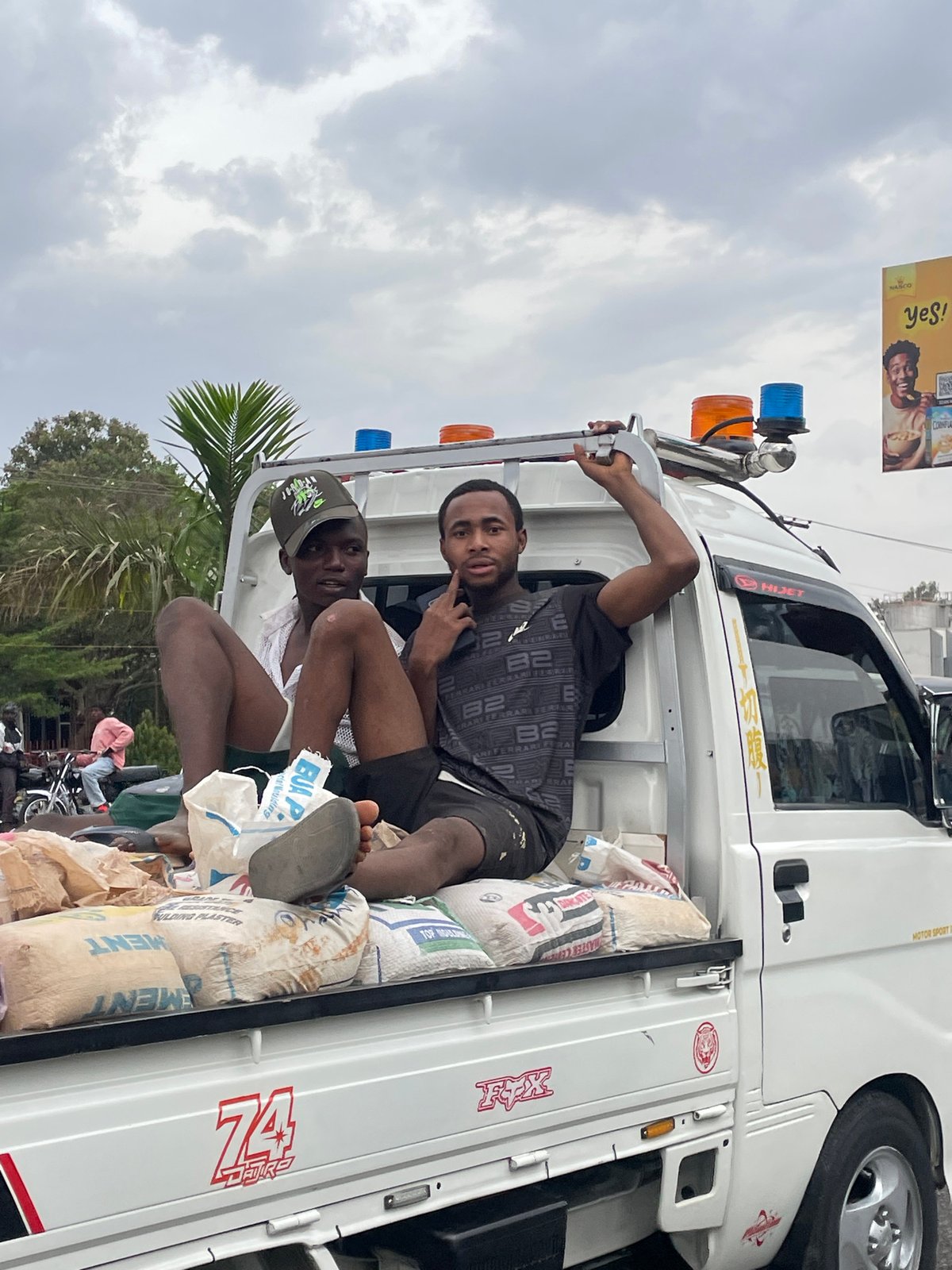 Daily life moments captured in Jos: cement transport, children skating
