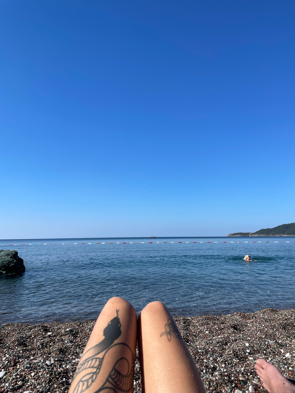 Lazy summer afternoon on a pebble beach in Montenegro