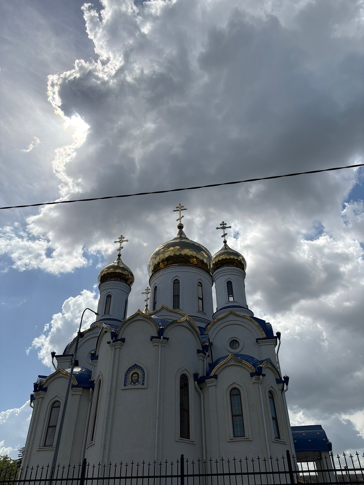 Orthodox church with golden domes photographed in Novopokrovskaya, Russia