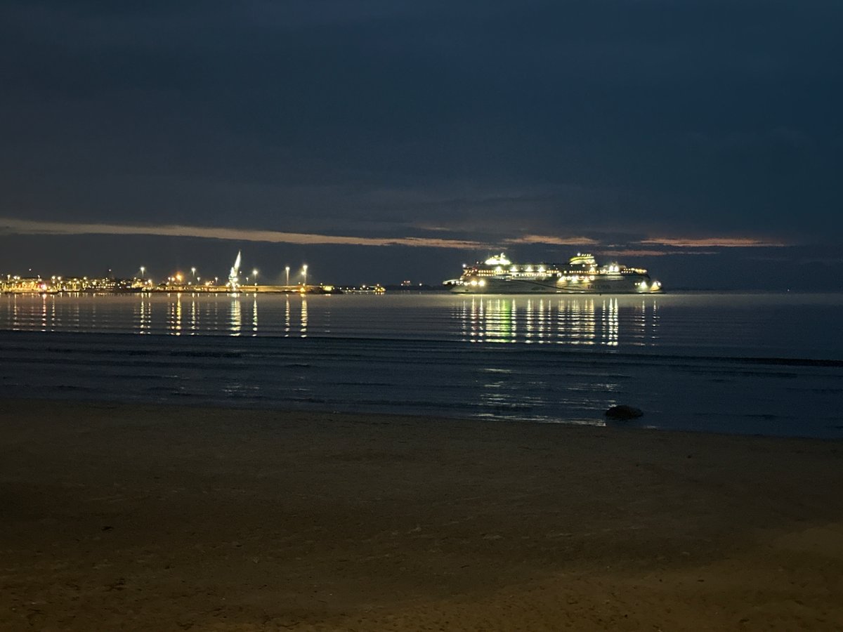 Evening stroll documented along Tallinn's illuminated waterfront and beaches