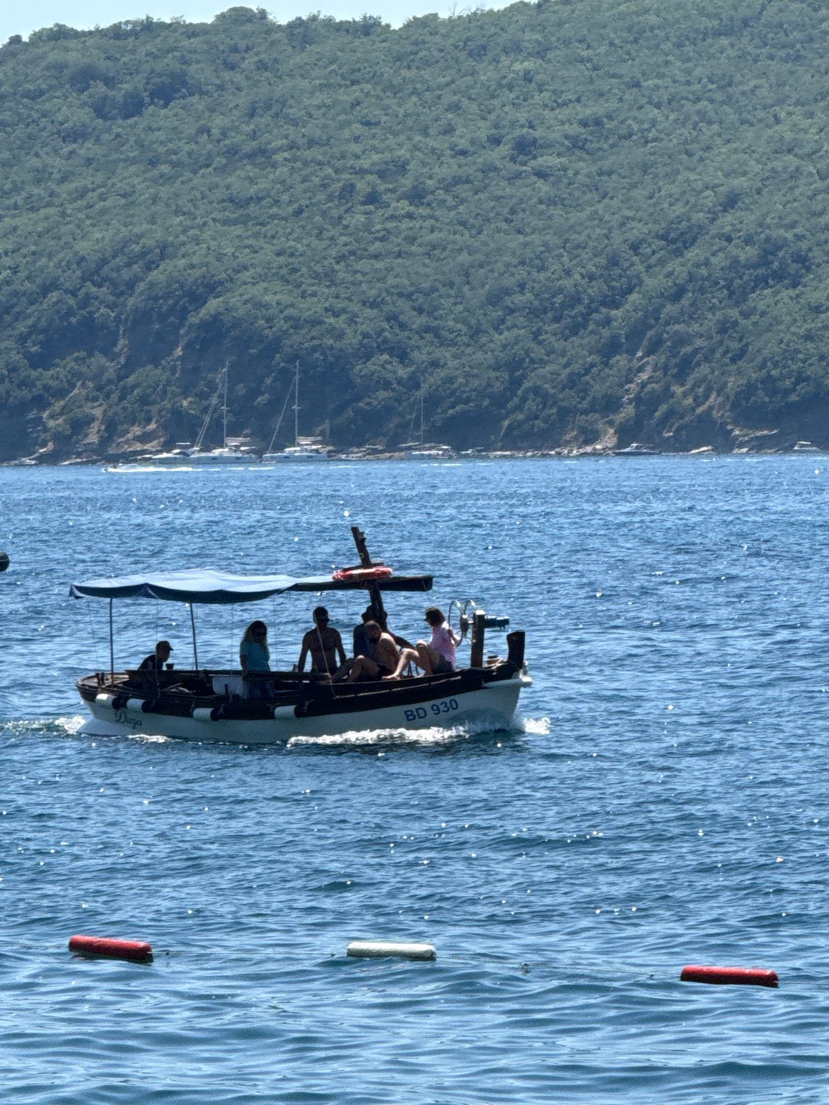 Boats and swimmers on the Adriatic near Budva, Montenegro