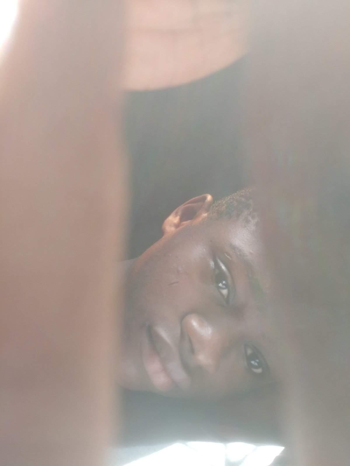 Young man photographed in close-up portraits in Shangisha, Nigeria
