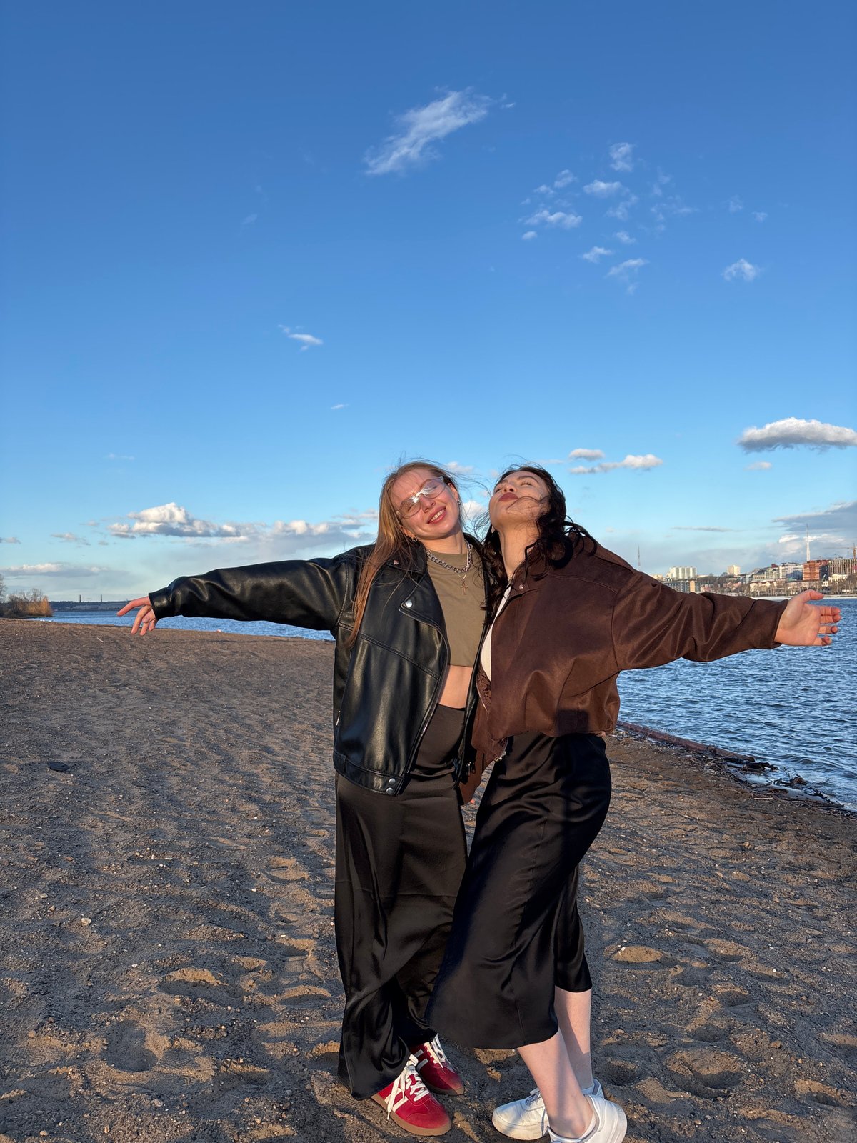 Young women pose for photos on Perm riverbank