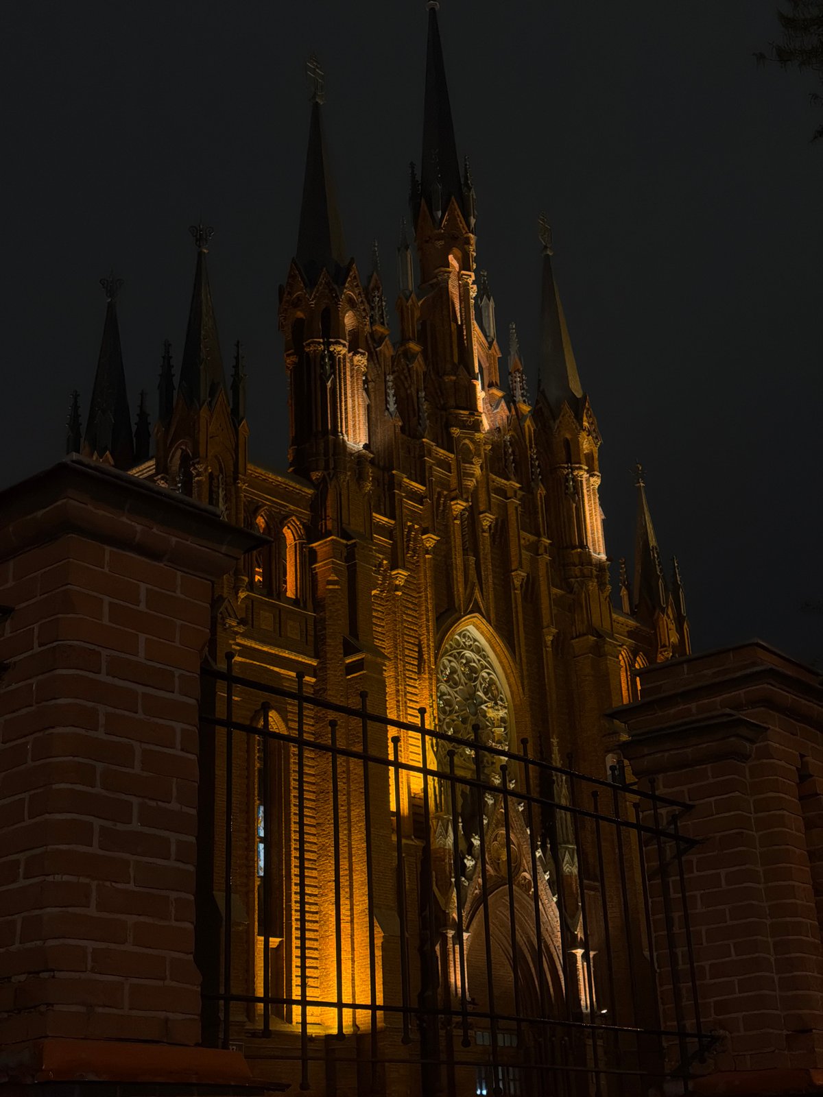 Ornate Moscow cathedral illuminated in golden light at night