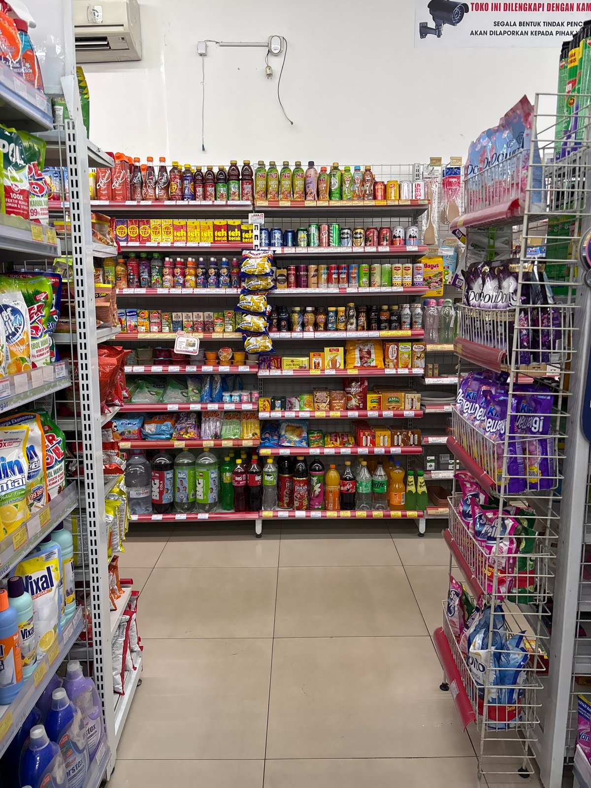 Unknown person documents Alfamidi store sections in Tangerang