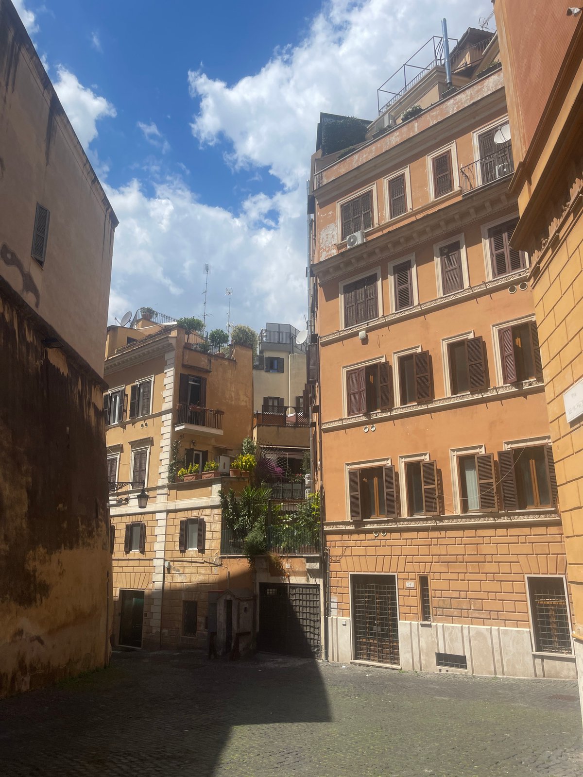 Tourist documents leisurely morning walk through historic Rome streets