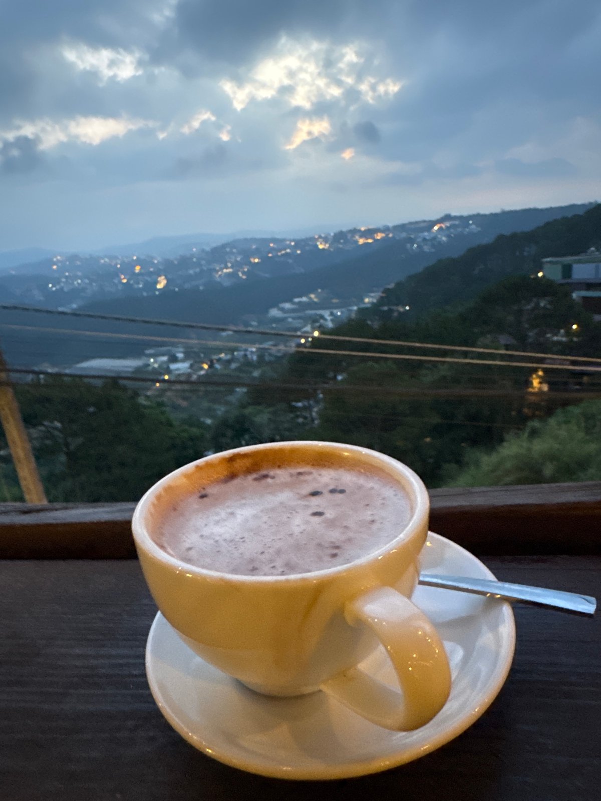 Evening views of Da Lat captured from hillside cafes
