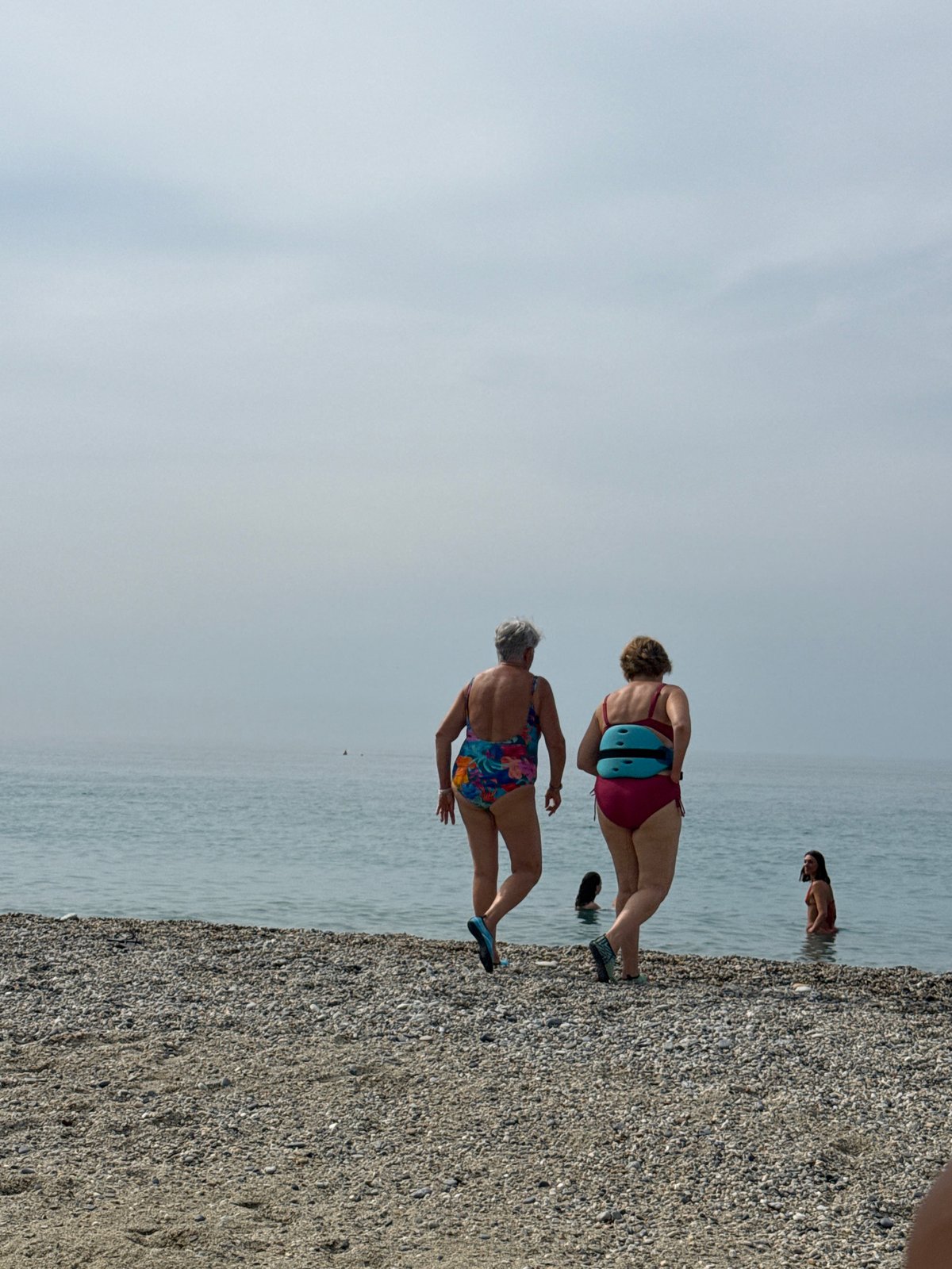Summer morning on the pebble beach at Finale Ligure