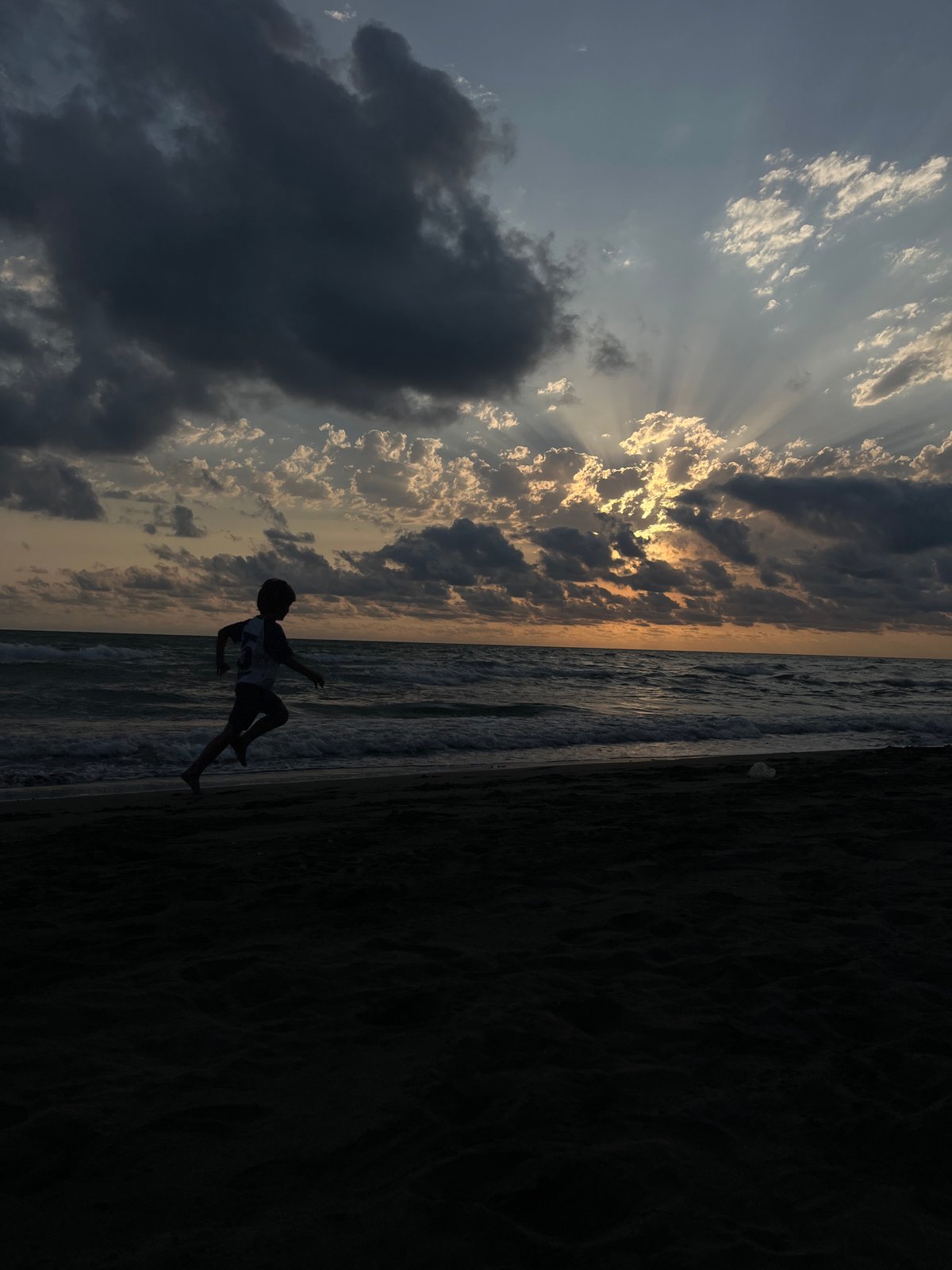 Stormy sunset light breaks through clouds over the Black Sea