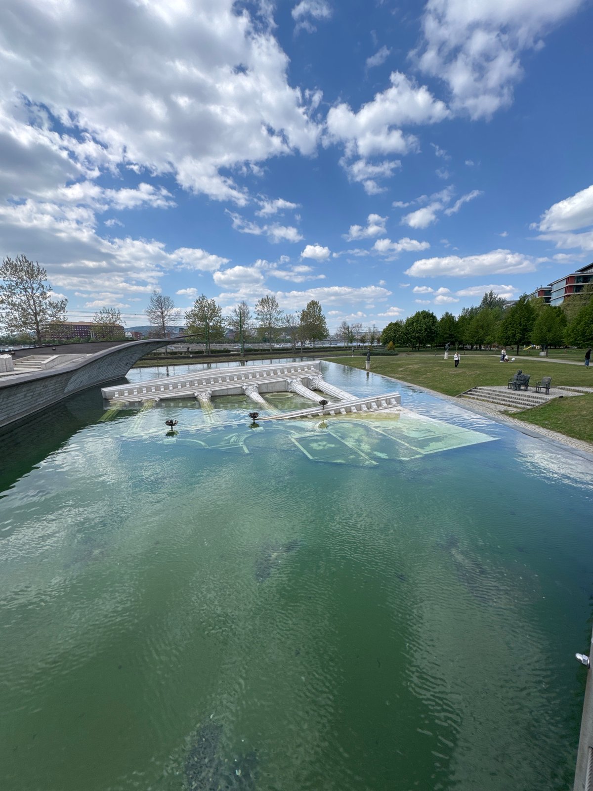 Budapest public space with reflecting pool documented by witnesses