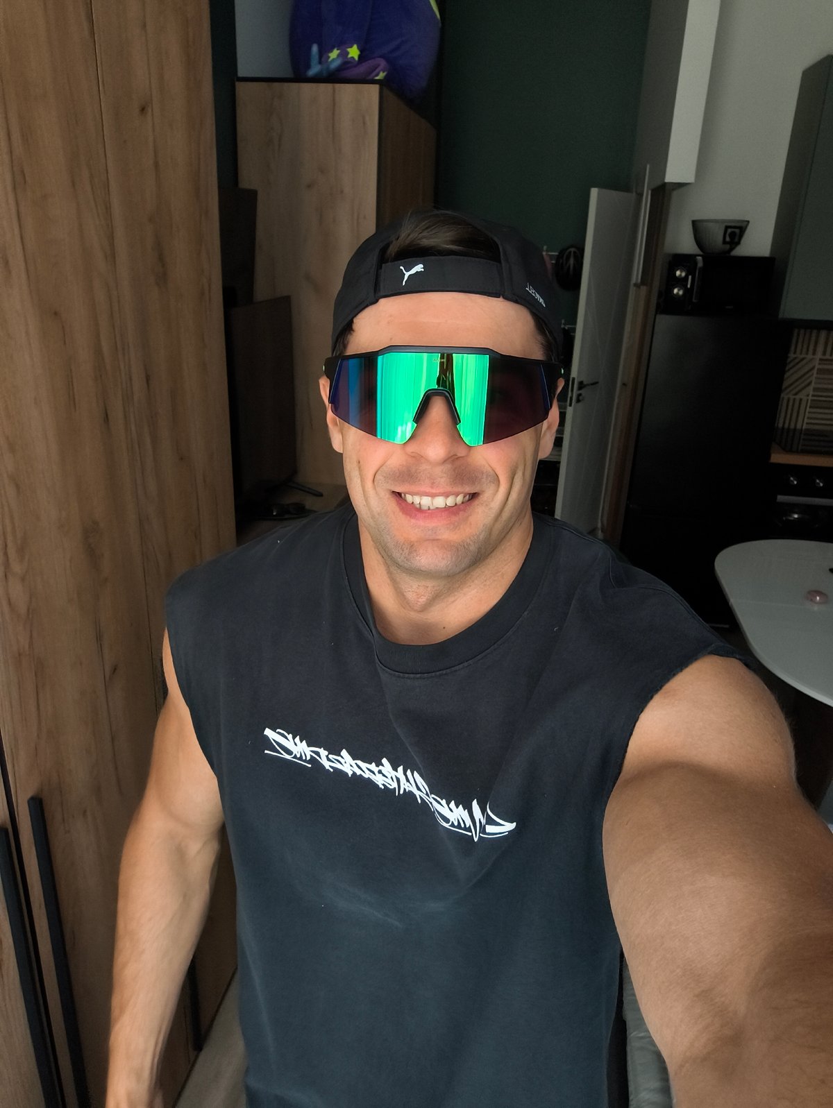 Man takes smiling selfie in Moscow residential space