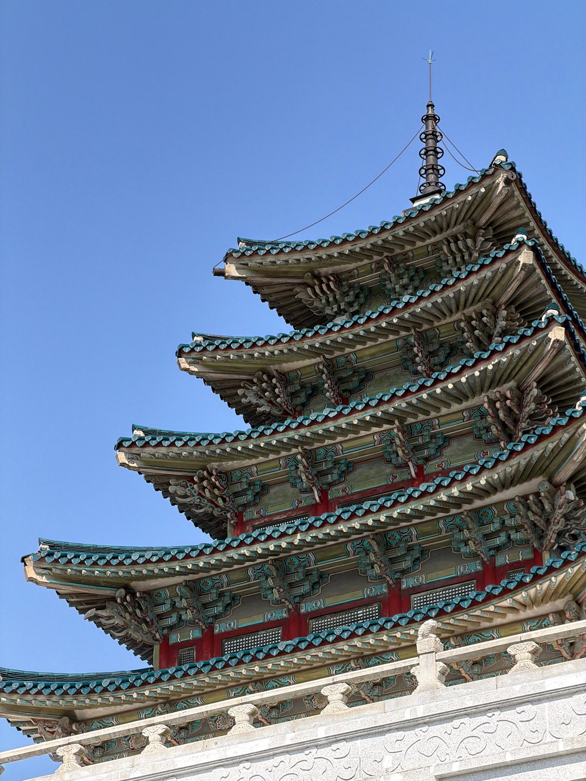 Traditional Korean architecture photographed alongside modern buildings in Seoul
