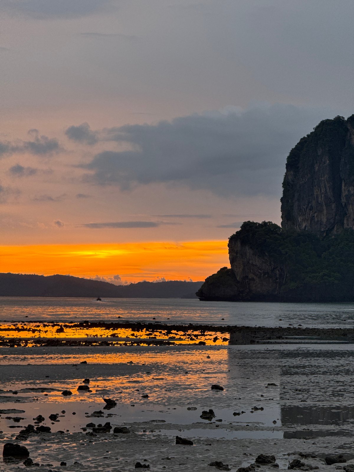 Limestone cliffs and low tide at Ban Ao Nang sunset