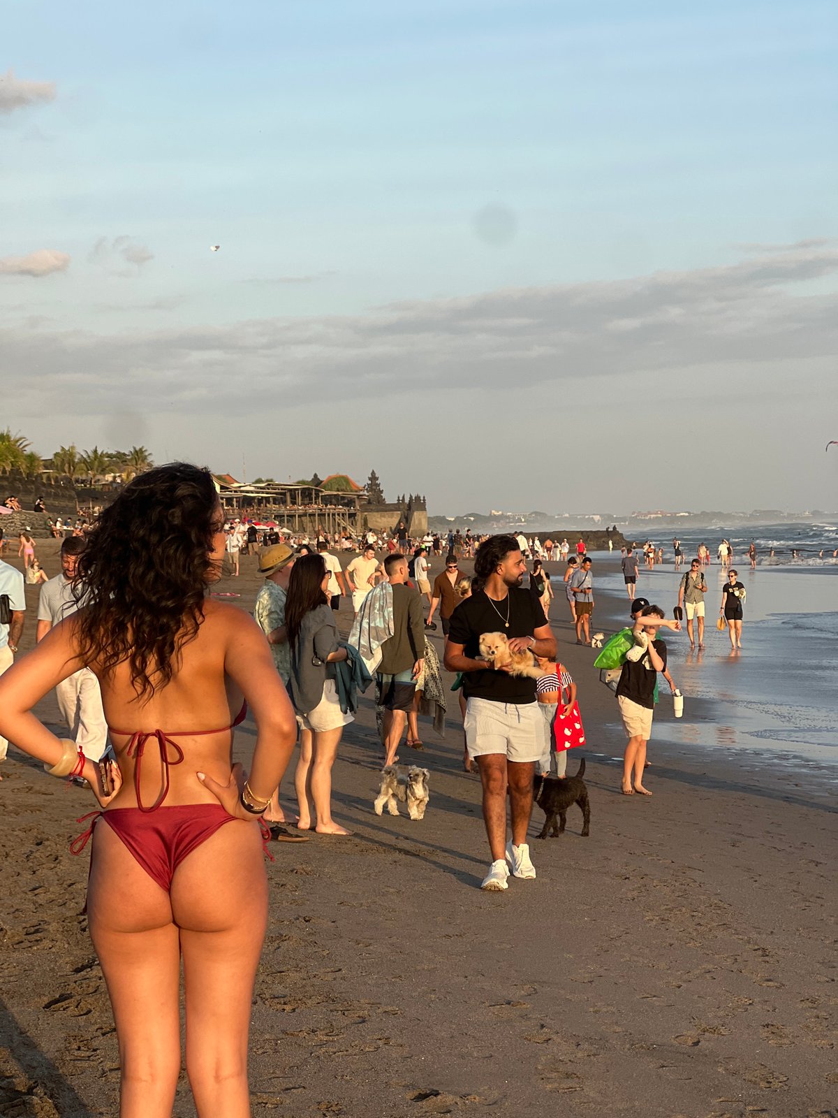 North Kuta beach at golden hour, crowds soaking up the sunset