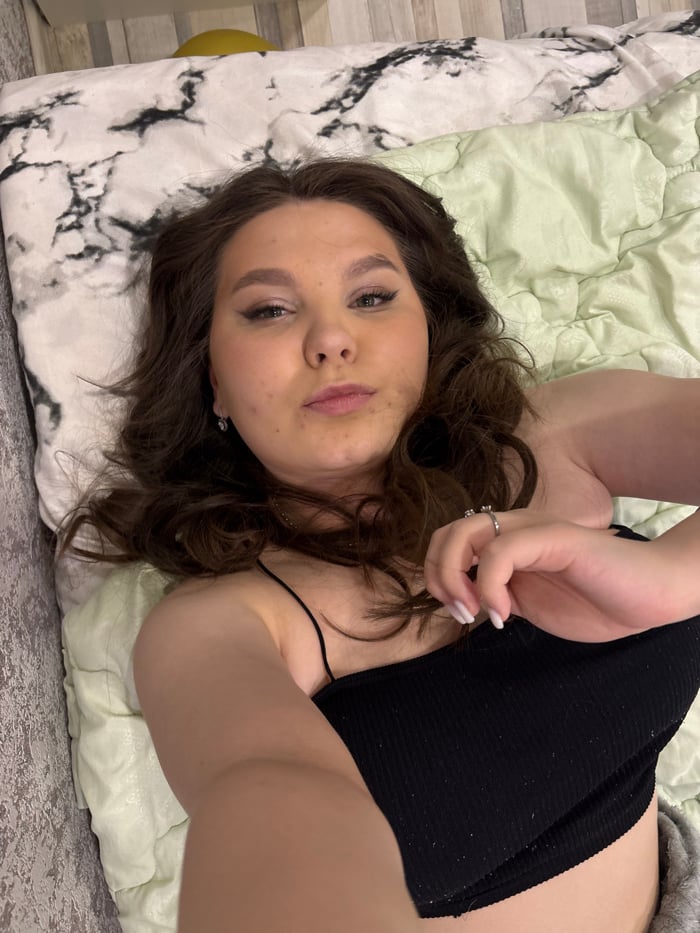 Woman documents evening selfie session in Perm apartment