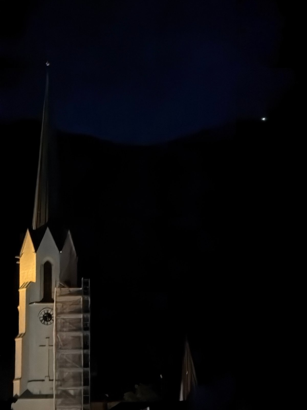 Garmisch-Partenkirchen at night: church, cobblestones, crescent moon