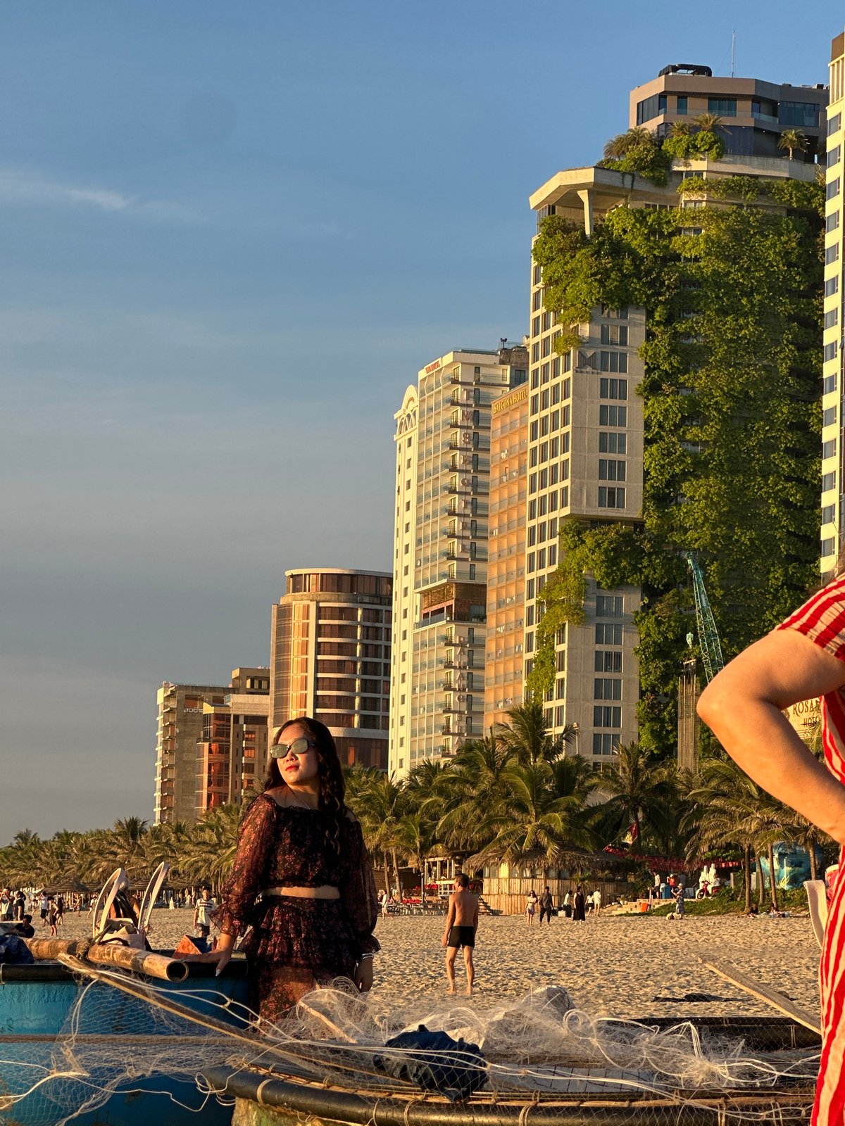 Golden hour at My Khe Beach, Đà Nẵng skyline behind