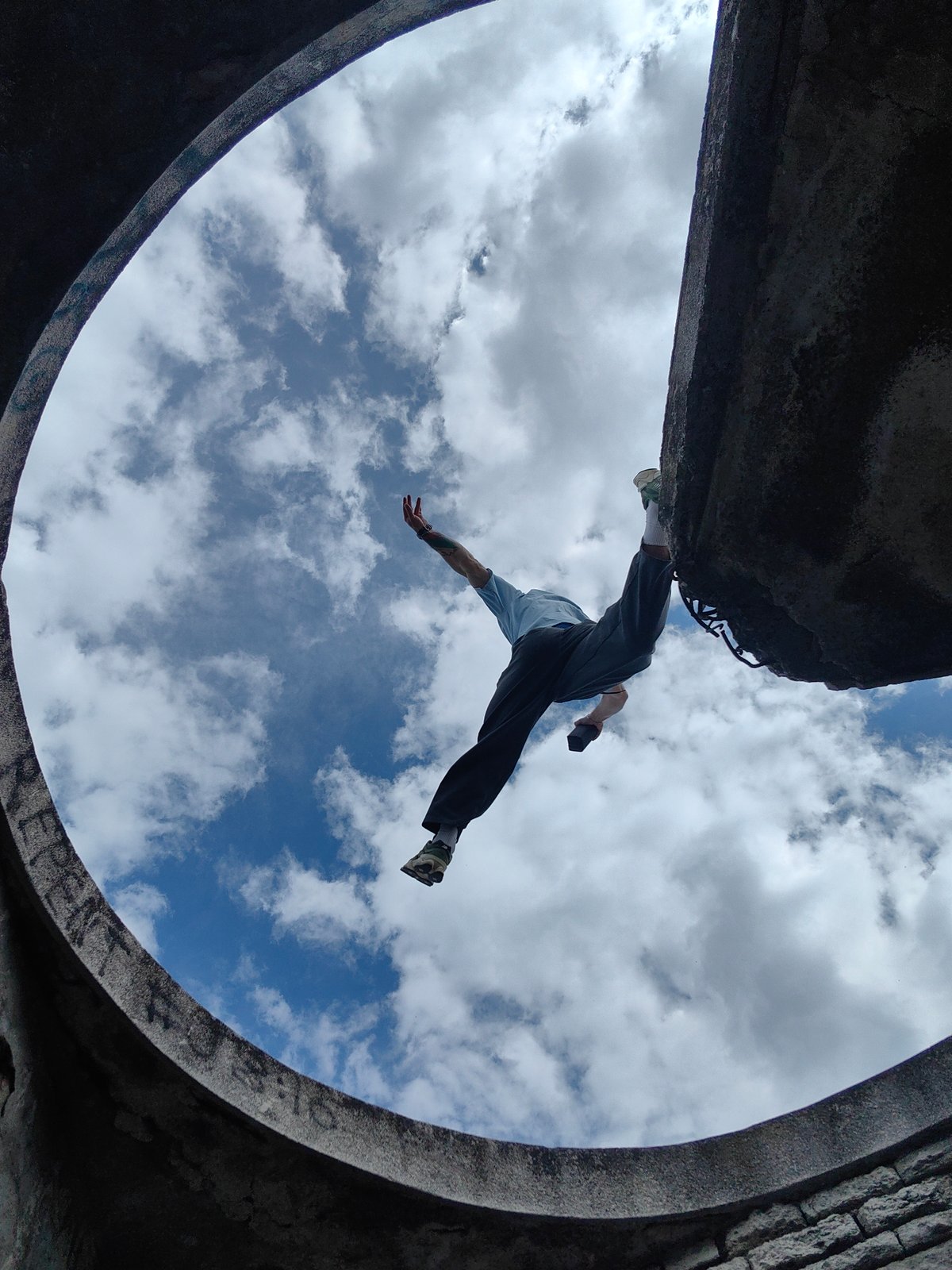 Person captured in dynamic pose from concrete structure in Varna