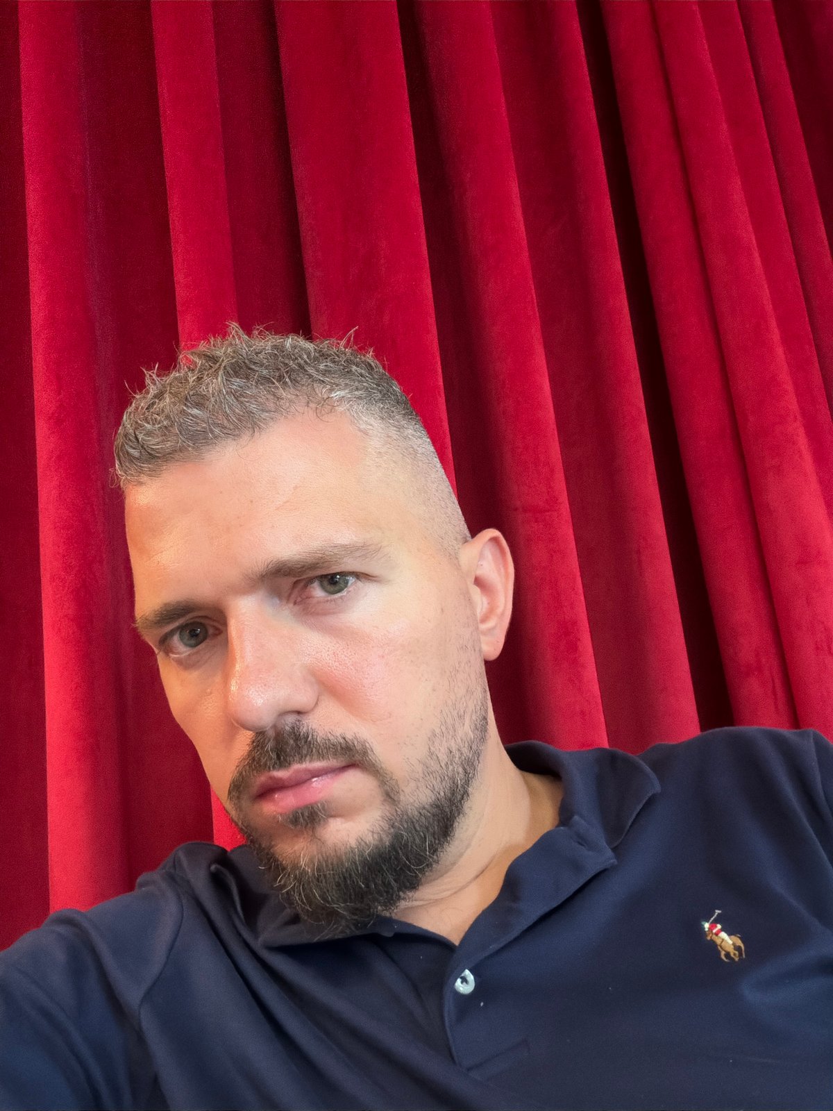 Selfies and downtime shots at a Dubai venue with red velvet curtains
