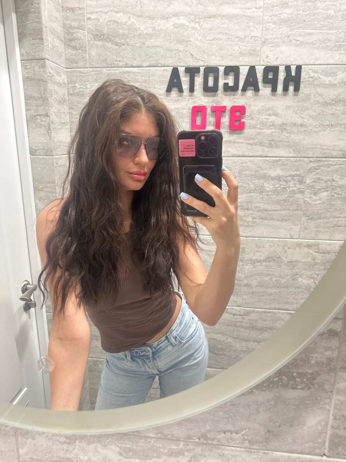 Woman takes bathroom mirror selfies in Moscow