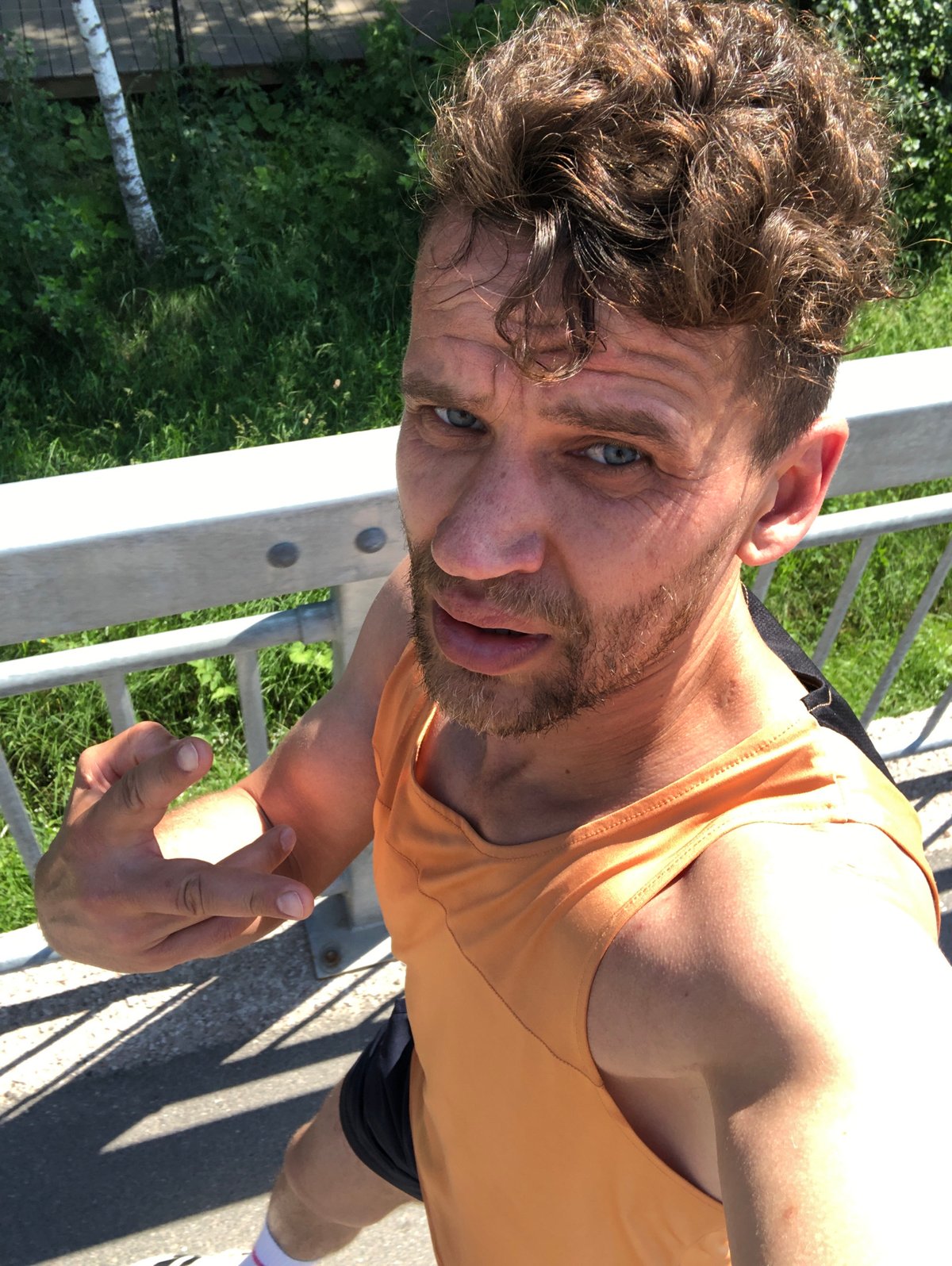 Selfie session on a Saint Petersburg pedestrian bridge, summer 2026