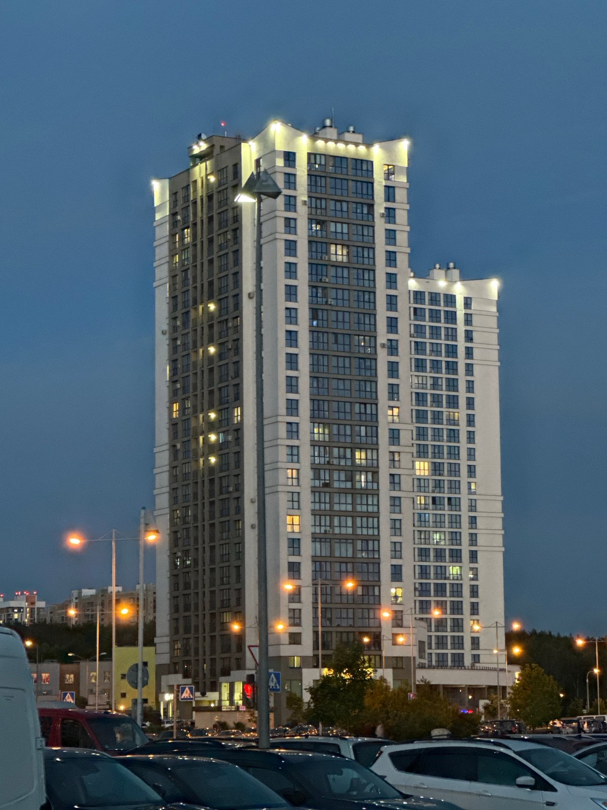 Evening architectural photography session captures modern Minsk buildings at twilight