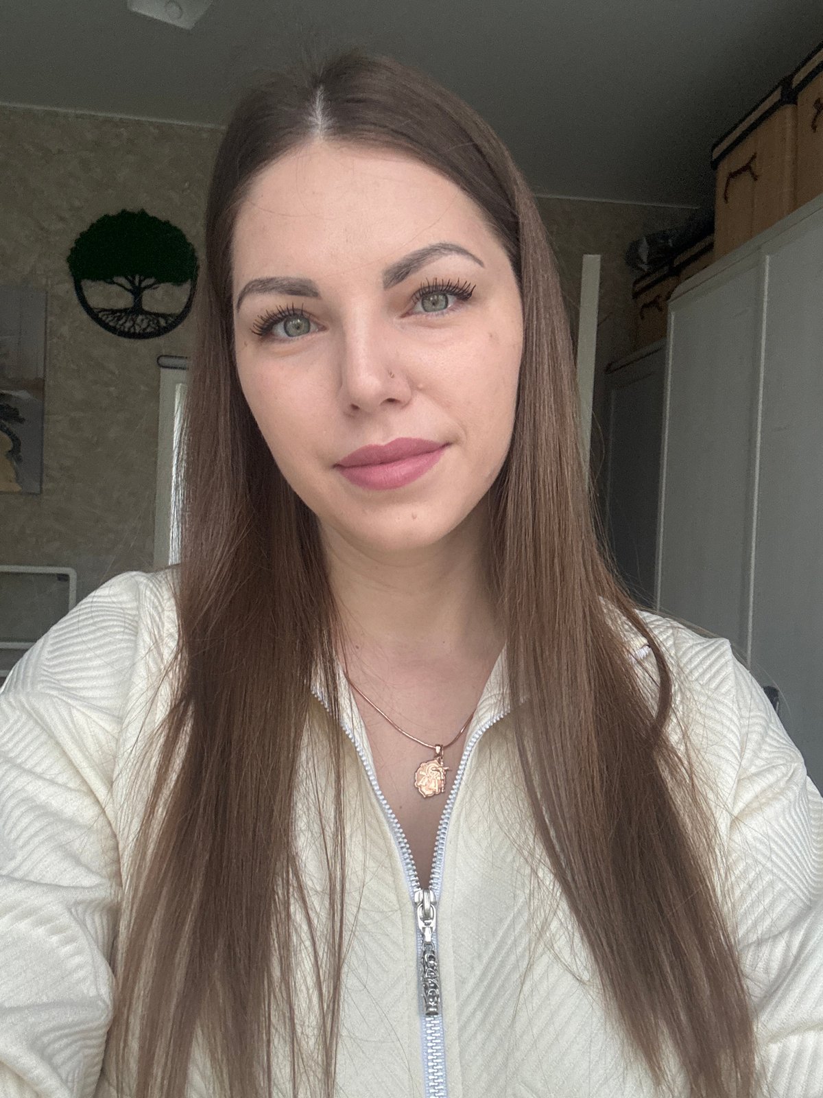 Woman takes selfies during rainy morning in Раздолье, Russia