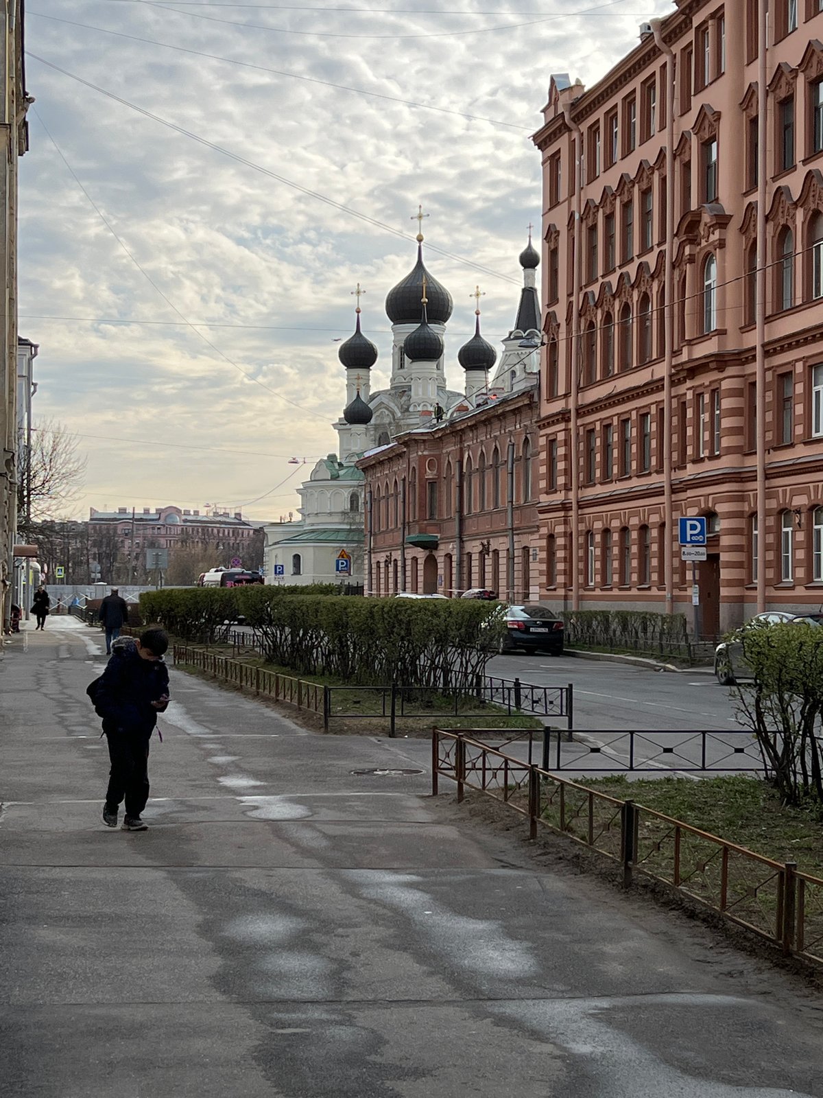 Everyday street life documented near Orthodox church in Saint Petersburg