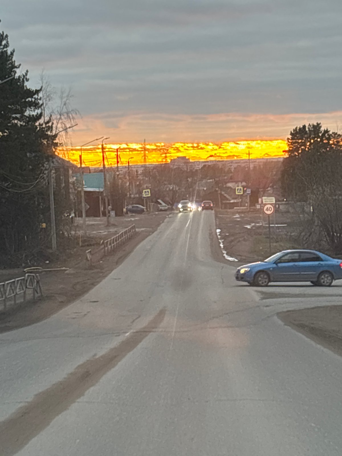 Golden sunrise captured over Chaikovsky roads, indoor portrait documented